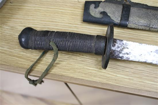 A 19th century Chinese sword, with shagreen and bronze mounted scabbard, the mounts slightly loose, with a fullered steel blade,